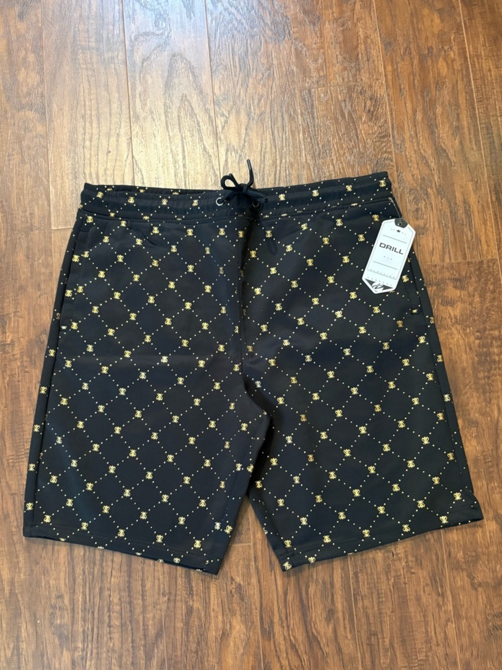 XL Men’s Black Shorts with a Gold Bee Design W/Drawstring and Stretchy Band.